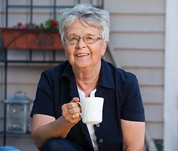 Senior woman holding a cup